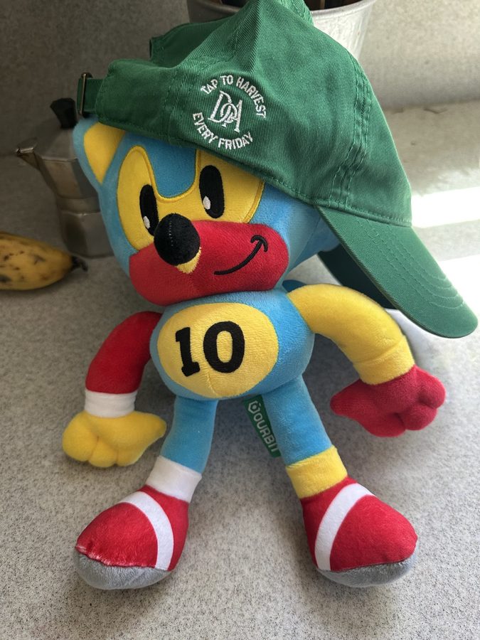 A Doubble plushie wearing the DOA hat
